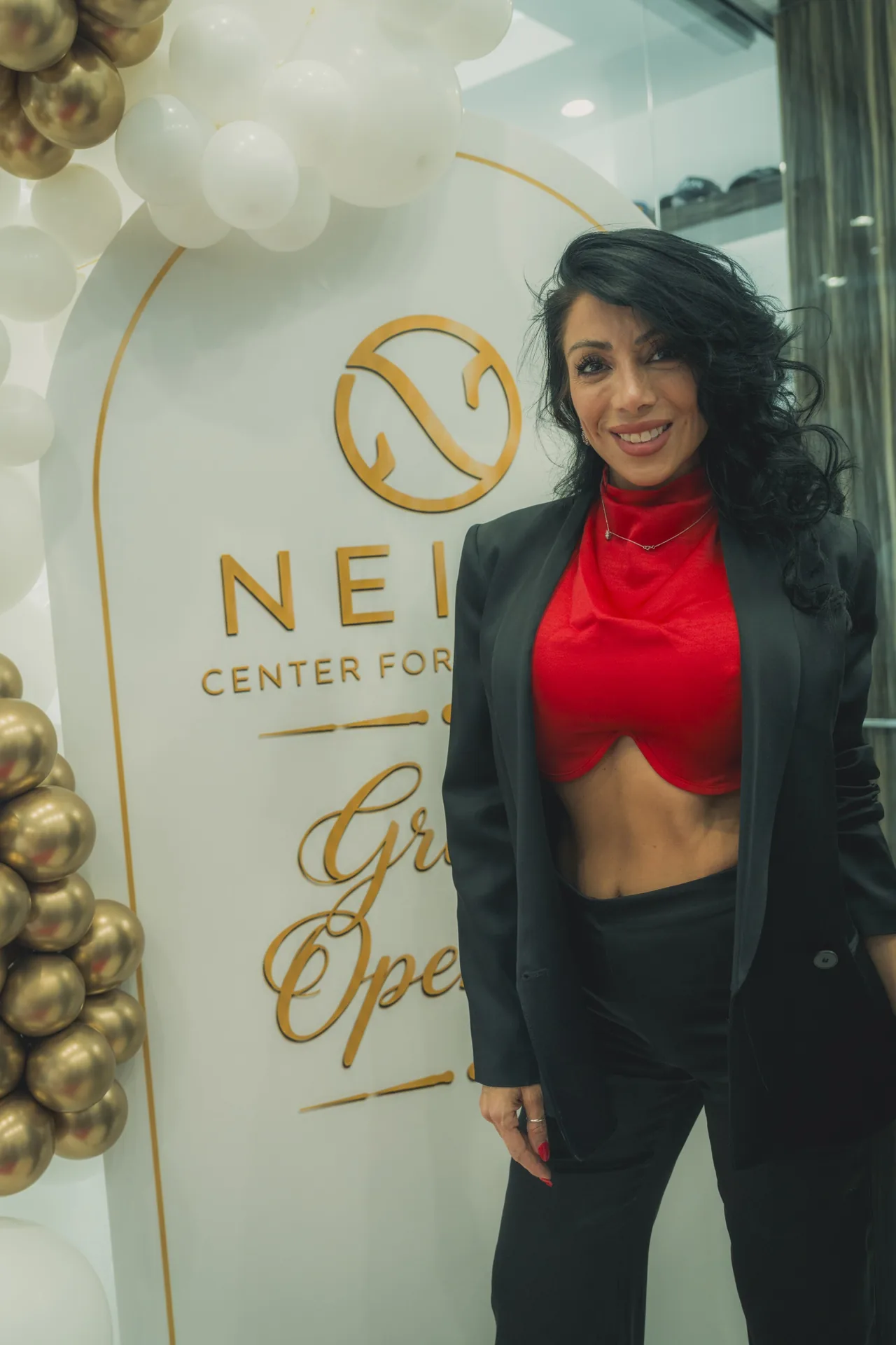 A guest at the Neios sign