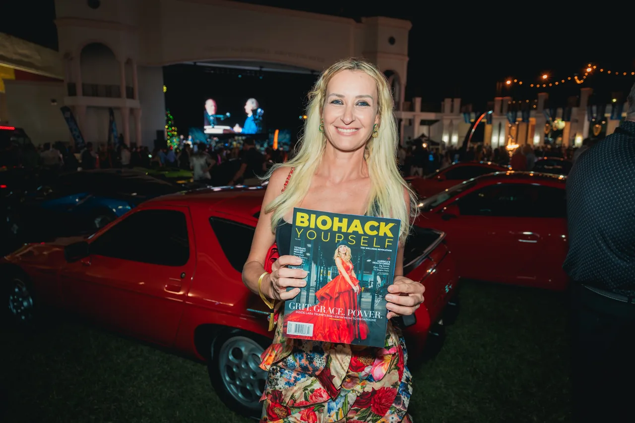 A guest with the magazine in front of a Lamborghini