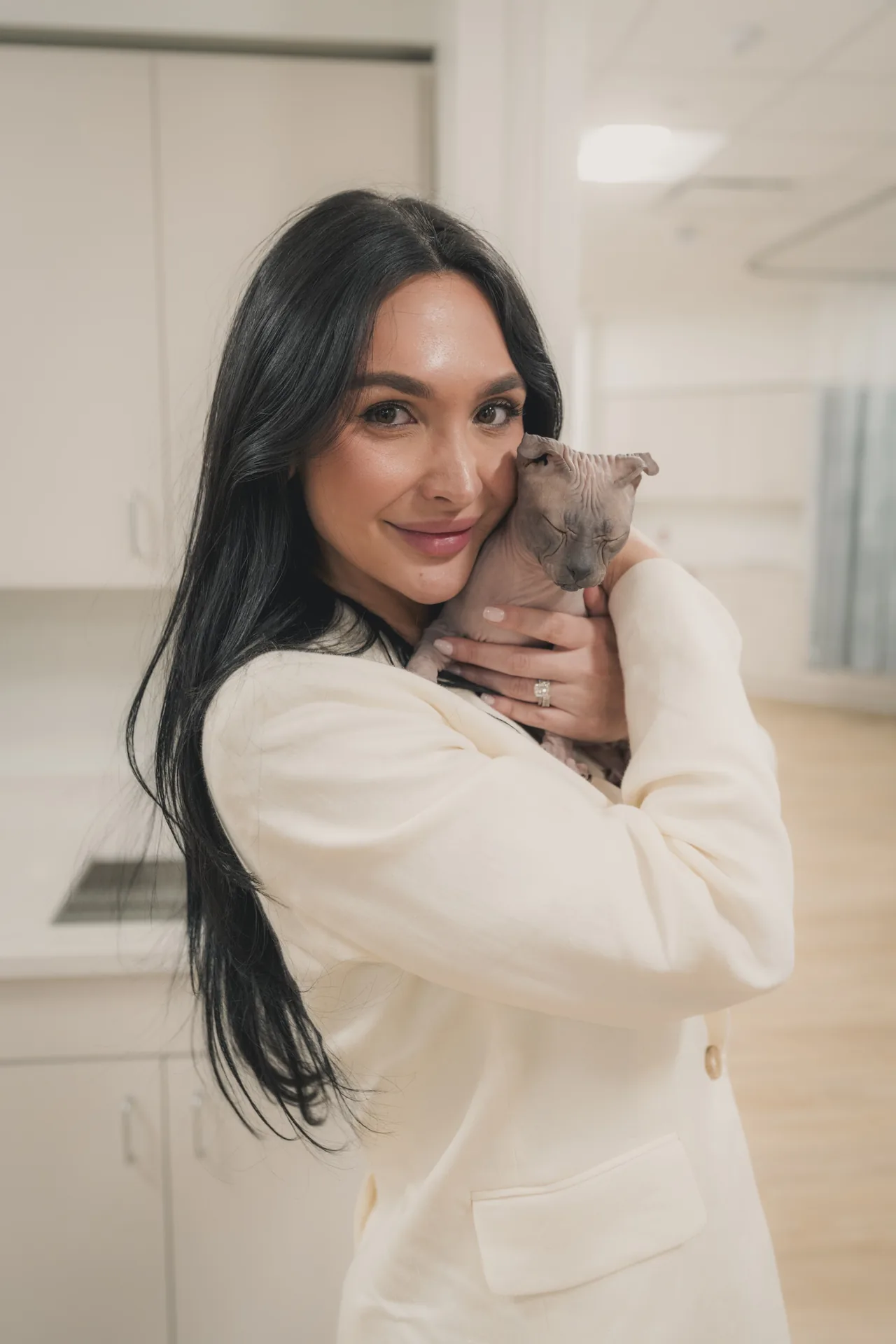 A guest with a puppy at the opening