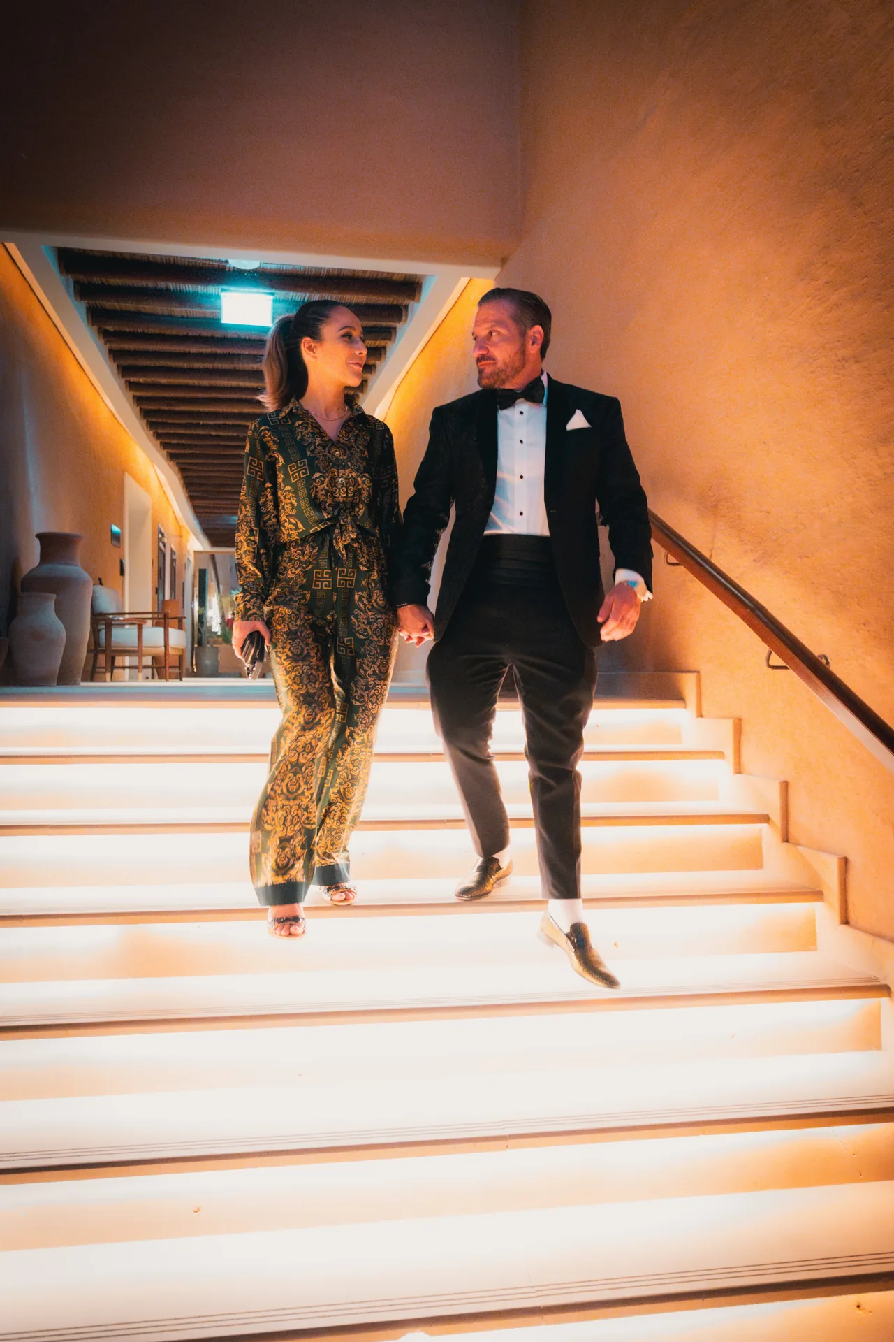 Anthony and TereZa on the lit stairs in Riyadh